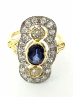Anello in oro giallo e bianco con zaffiro e diamanti