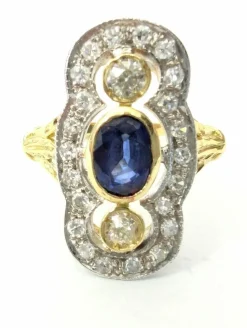 Anello in oro giallo e bianco con zaffiro e diamanti