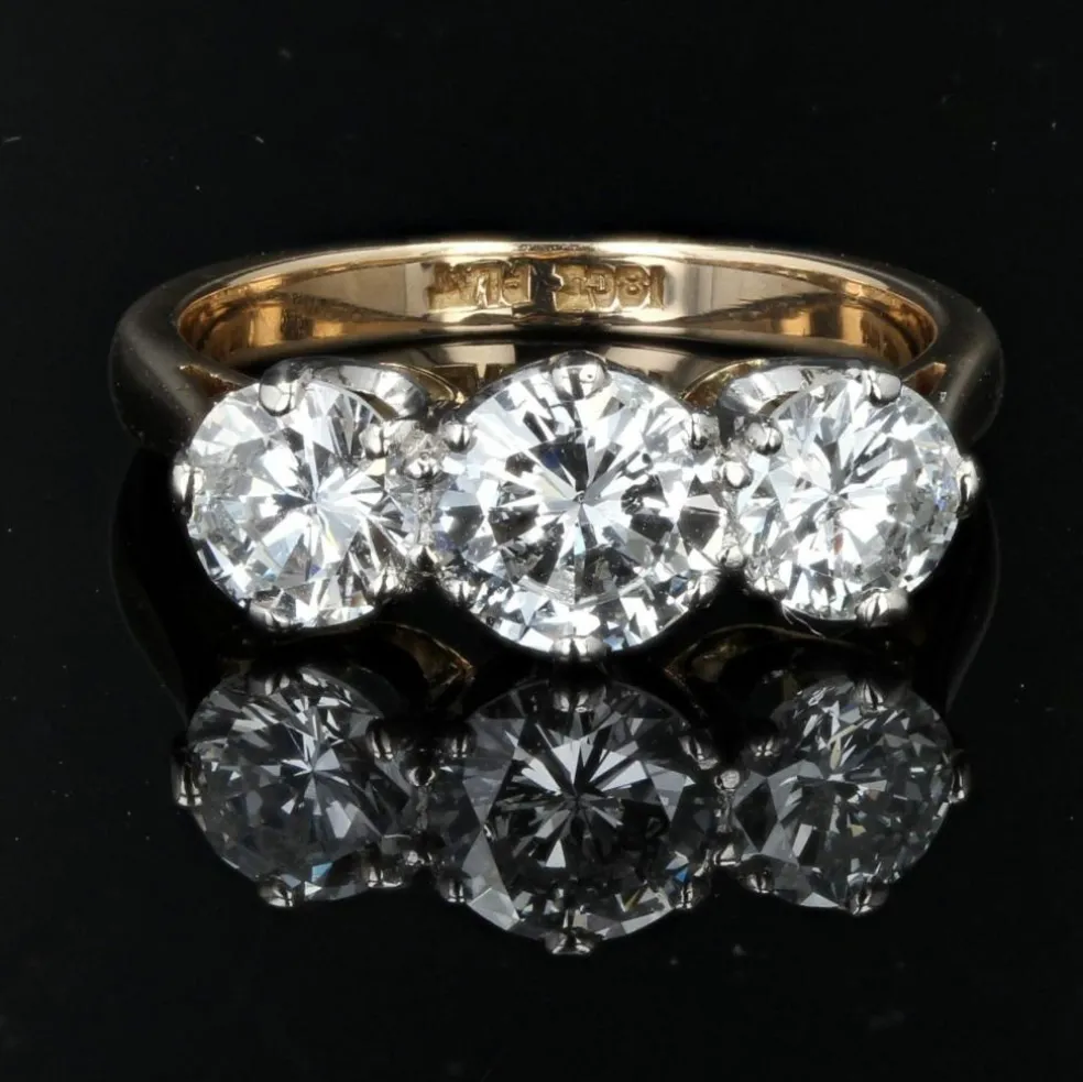 Bague ancienne diamants en jarretière