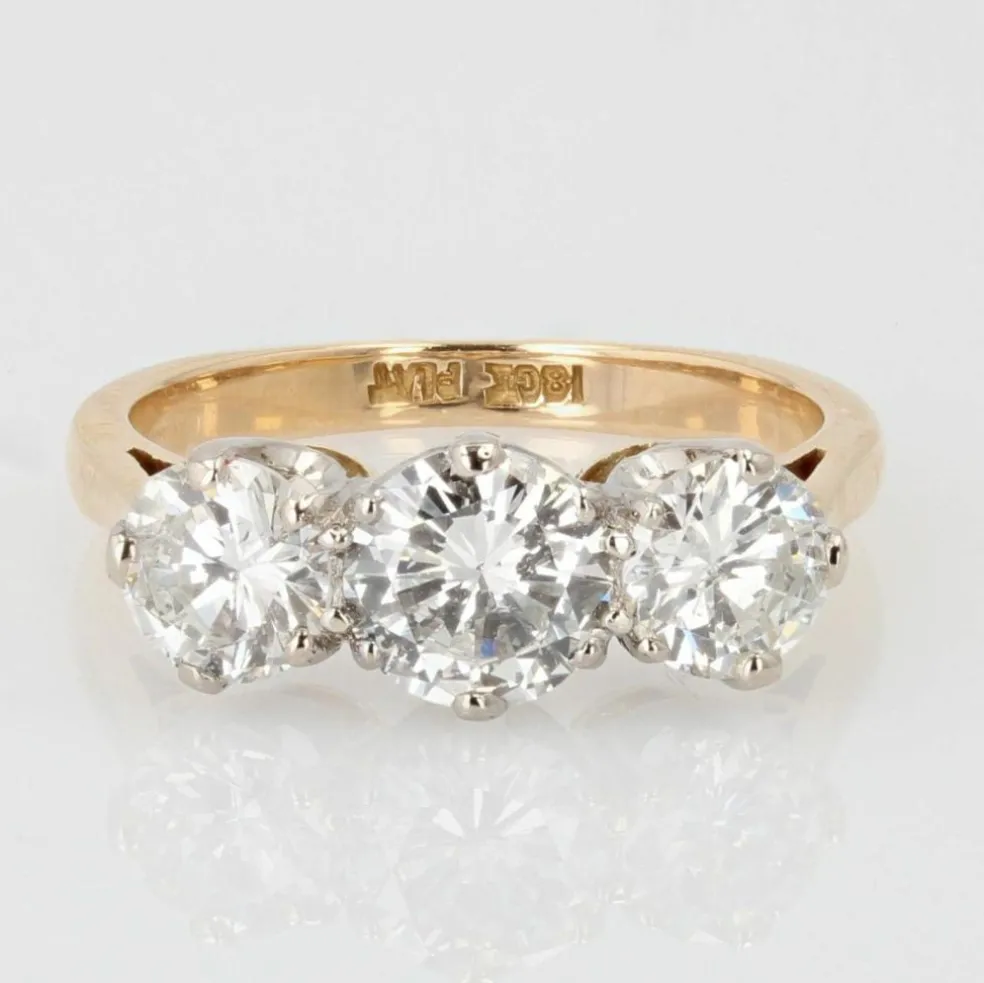 Bague ancienne diamants en jarretière