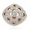 Bague boule ajourée d'un décor de fleur et diamants