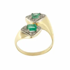 Bague contraire avec émeraudes et diamants