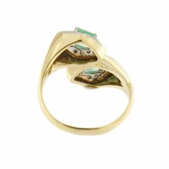 Bague contraire avec émeraudes et diamants