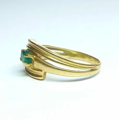 Bague croisée en or jaune et émeraude