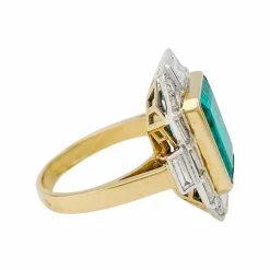 Bague deux ors émeraude et diamants.