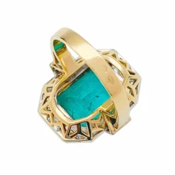Bague deux ors émeraude et diamants.