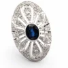 Bague en or blanc avec saphir central et diamants