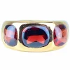 Bague en or jaune 18 carats ornée de 3 grenats