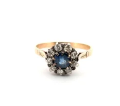 Bague en or jaune et argent avec saphir central et diamants environnants