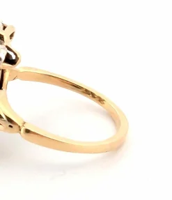Bague en or jaune et argent avec diamant rose central et diamants latéraux