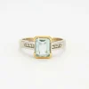 Bague en or jaune et gris sertie d'une aigue-marine et de diamants