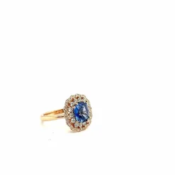 Bague en or rose 18 carats avec saphir bleu de Ceylan taille coussin et diamants