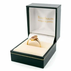 Bague en or rose 14 carats avec diamants et rubis