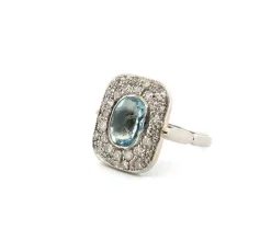 Bague en platine avec aigue-marine centrale et diamants environnants