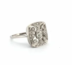 Bague en platine avec diamant central et diamants latéraux