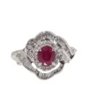 Bague entourage en platine, rubis ovale et diamants