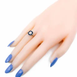 Bague halo en platine avec saphir et diamant