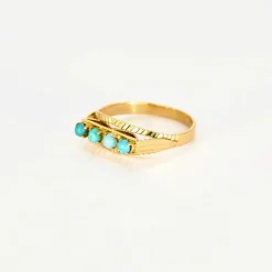 Bague jarretière turquoises en or rose