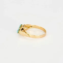 Bague jarretière turquoises en or rose