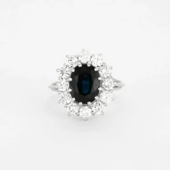 Bague marguerite saphir entourage diamants en or blanc