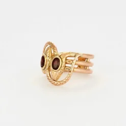 Bague or bicolore motif serpent et grenats