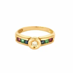 Bague or jaune centré d'un diamants, épaulée rubis, saphir, émeraude