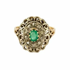Bague or jaune et argent, centrée d'une émeraude