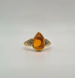 Bague or jaune sertie de diamants et une citrine