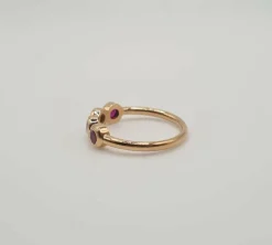 Bague or rose sertie de rubis roses