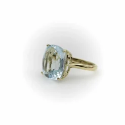 Bague Signature en or 14 carats et topaze bleu clair 6 carats