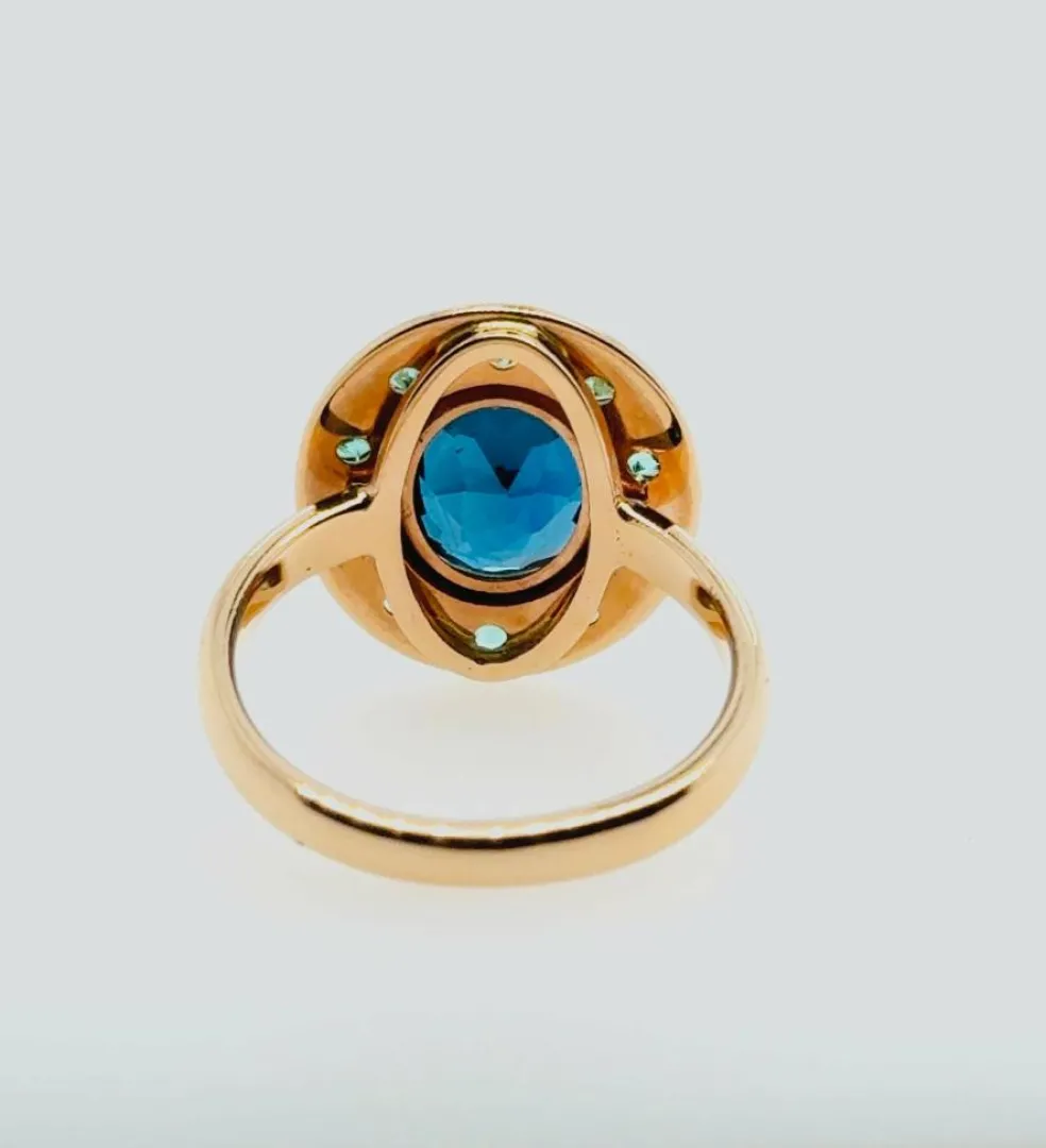 Bague topaze bleue émeraude or rose