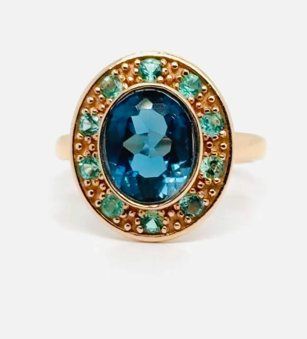 Bague topaze bleue émeraude or rose