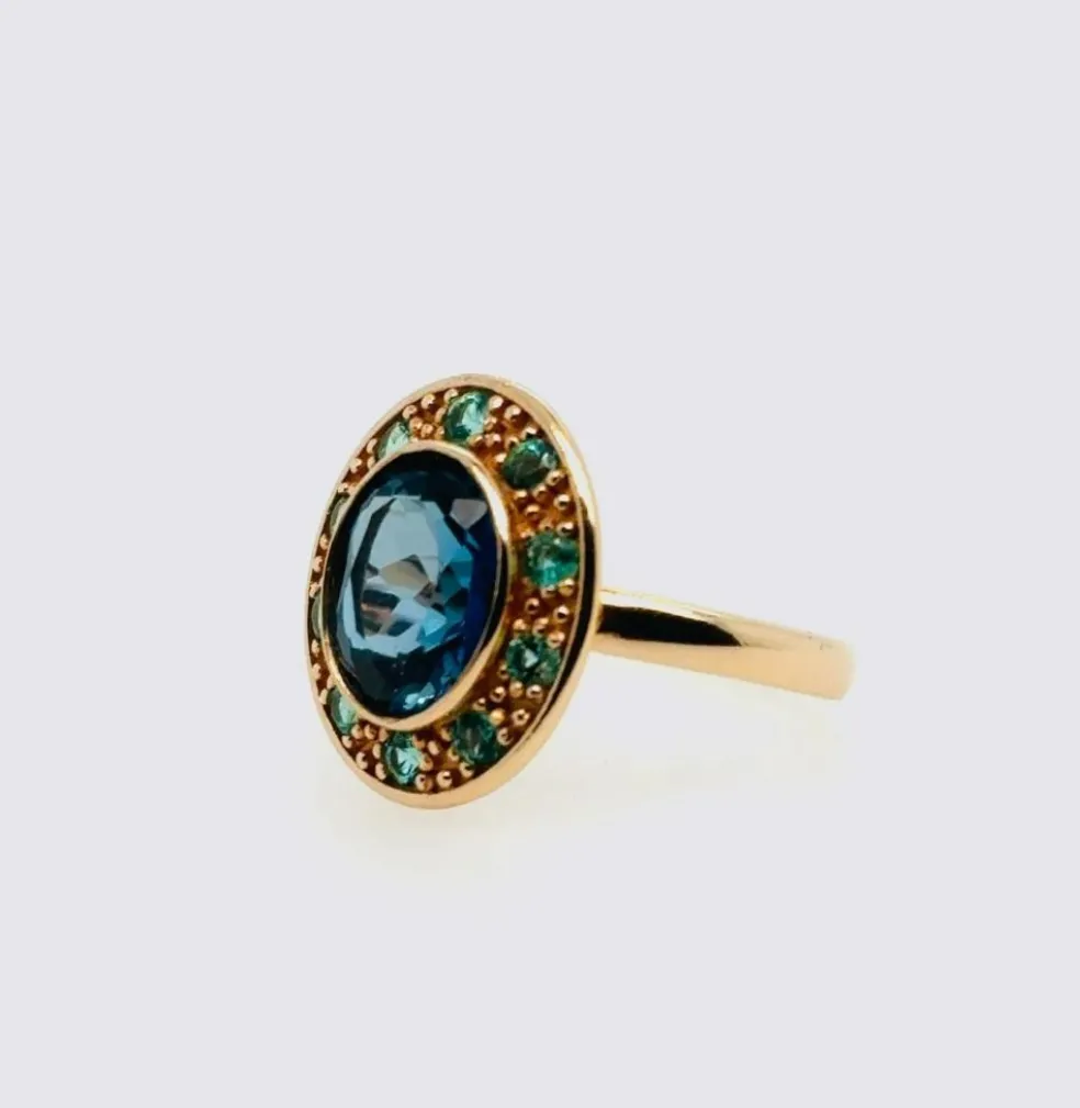 Bague topaze bleue émeraude or rose