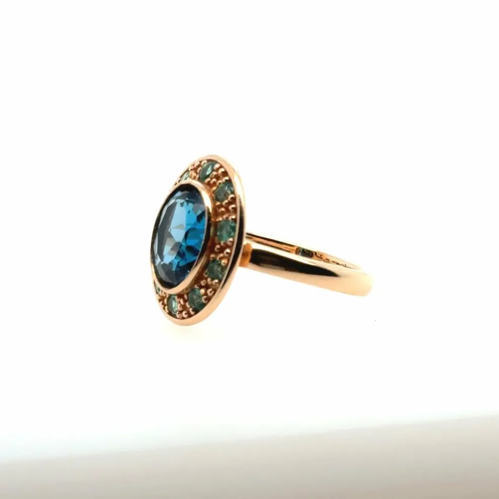 Bague topaze bleue émeraude or rose