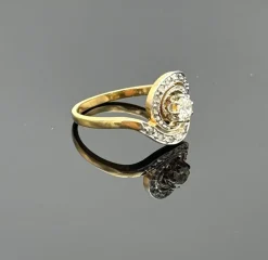 Bague tourbillon ancienne en or avec diamant