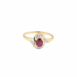 Bague tourbillon en or jaune diamants et rubis