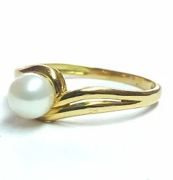 Bague tourbillon or jaune, perle