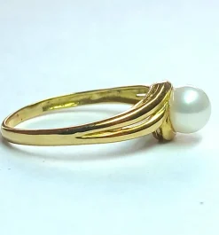 Bague tourbillon or jaune, perle