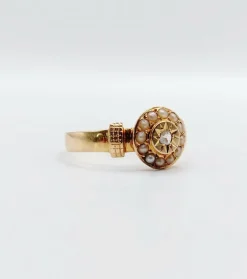 Bague victorienne or rose ornée d'un diamant en serti étoilé entouré de perles