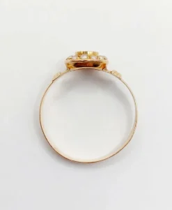 Bague victorienne or rose ornée d'un diamant en serti étoilé entouré de perles
