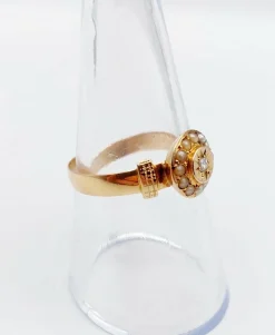 Bague victorienne or rose ornée d'un diamant en serti étoilé entouré de perles