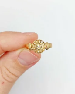 Bague victorienne or rose ornée d'un diamant en serti étoilé entouré de perles