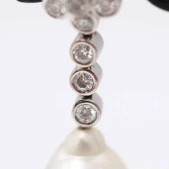 Boucles d'oreilles avec perle d'Australie et diamants