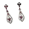Boucles d'oreilles de style Art Déco en platine avec diamants et rubis.