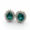Boucles d'oreilles en or blanc avec émeraudes et diamants