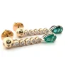 Boucles d'oreilles en or jaune avec émeraudes et diamants