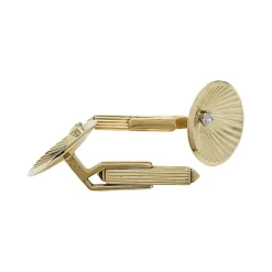 Boutons de manchette en or jaune et diamants.