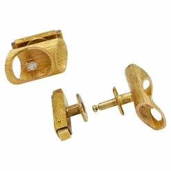 Boutons de manchettes "bambou" en or jaune et diamants, 1970.