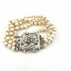 Bracelet de perles avec fermoir en or blanc massif et diamants