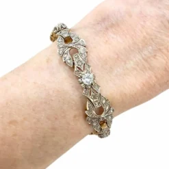 Bracelet design Art Déco en or jaune et platine avec diamants